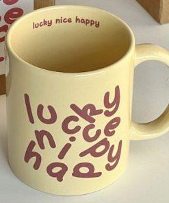 The ceramic cup adorned with the words "Lucky Nice Happy" is a charming and unique choice suitable for both friends and family, offering a delightful addition to any collection.